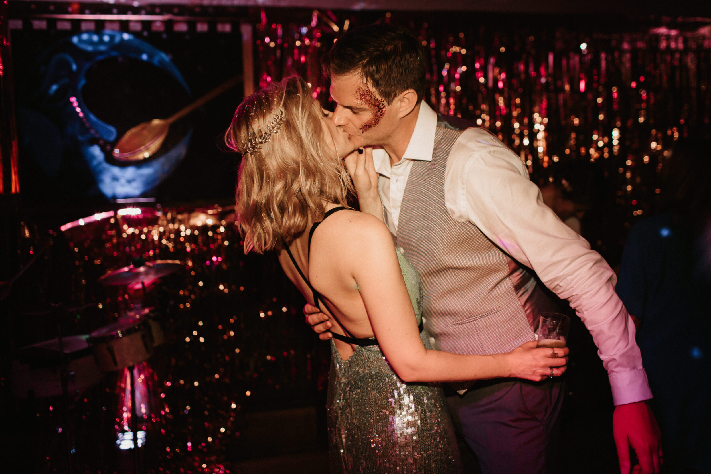 Bridal couple dancing coach house